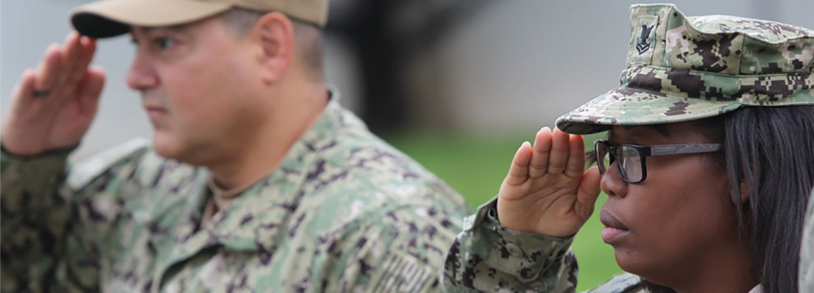Navy sailors at NSWC Corona sailors render a salute.